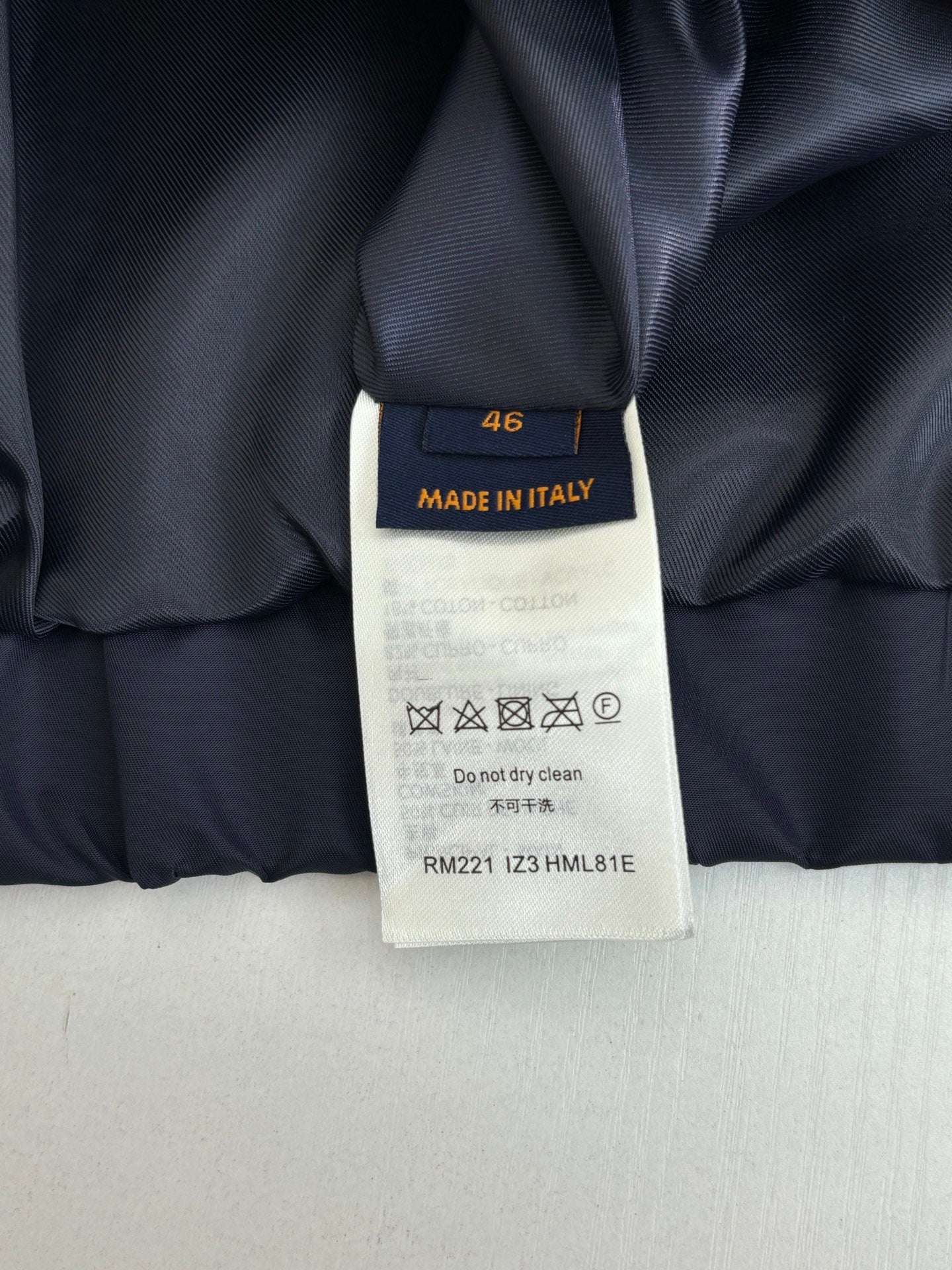 Louis Vuitton long pants size tag, Made in Italy, care symbols
