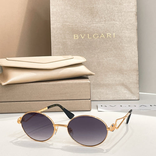 Bvlgari round sunglasses with gold-tone frame and dark tinted lenses
