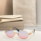 Bvlgari round sunglasses with gold-tone frame and pink-tinted gradient lenses