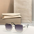 Bvlgari sunglasses with dark purple lenses and silver frame, square style