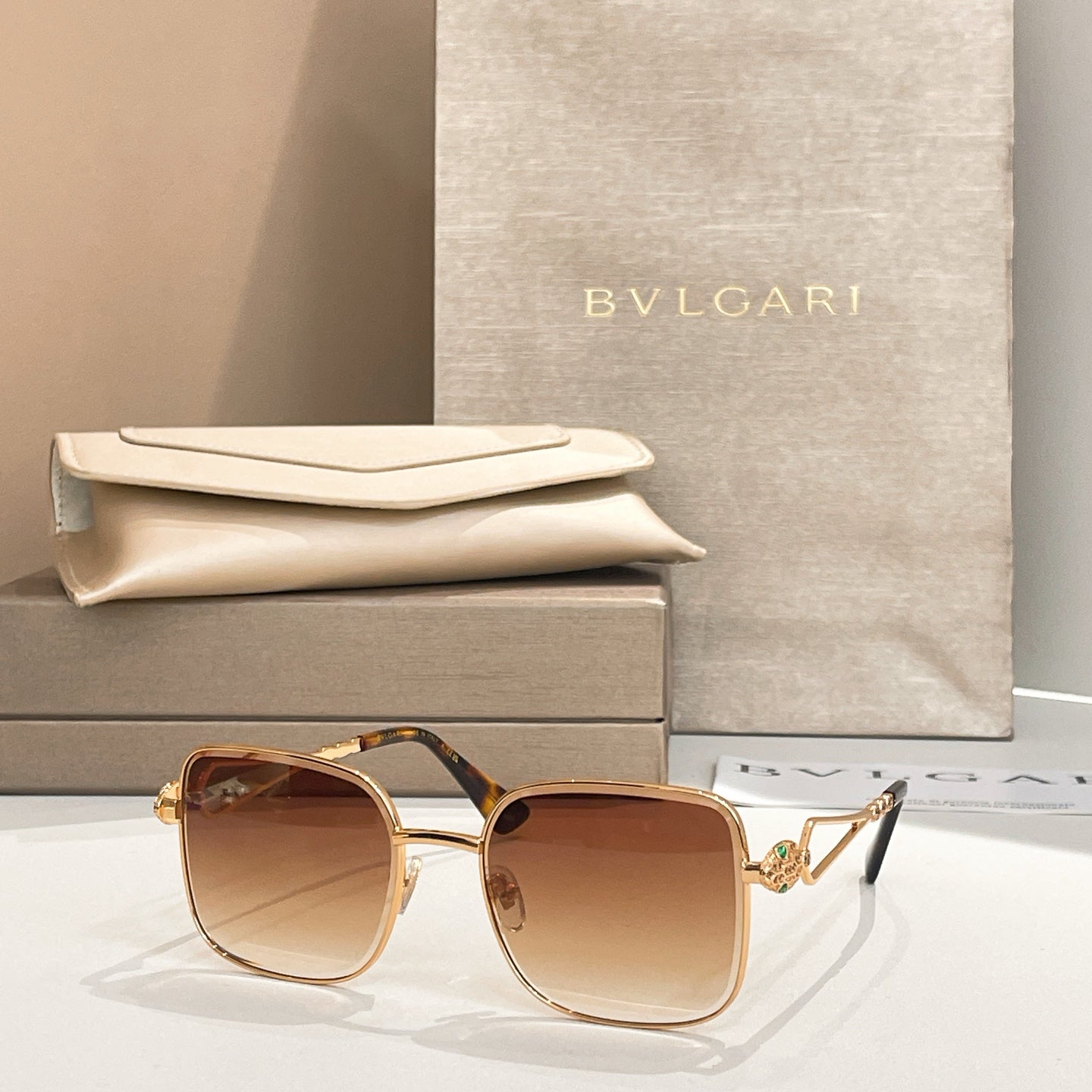 Bvlgari sunglasses with brown lenses and tortoiseshell arms, gold frame