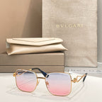 Bvlgari sunglasses with pink lenses, gold frame and blue-green temples