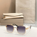 Bvlgari sunglasses with dark blue lenses and gold frame, square style