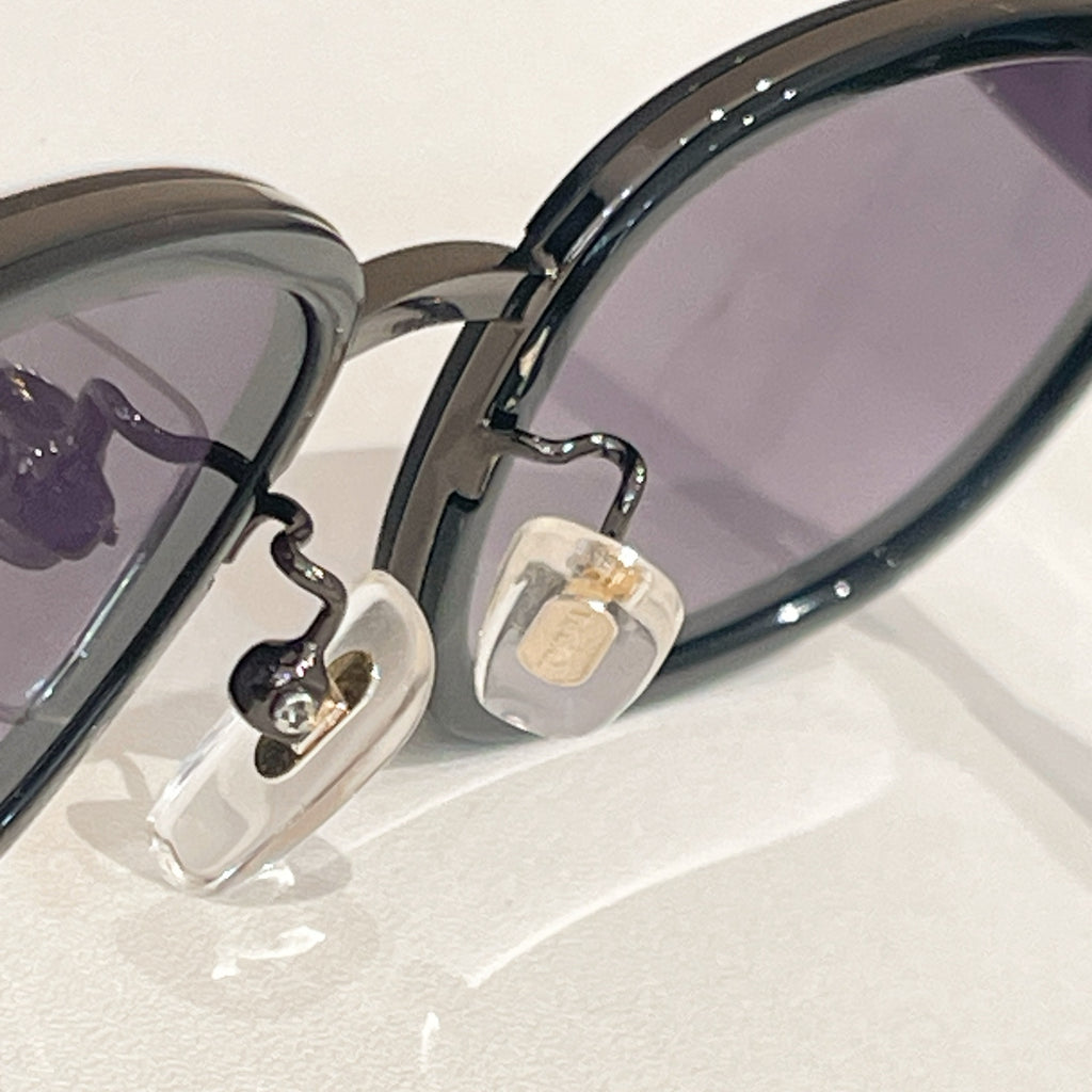 Versace sunglasses temple hinge detail with metal emblem