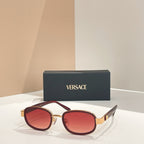 Versace sunglasses, gold frames with burgundy-red tinted lenses