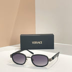 Versace sunglasses, black frames with dark purple tinted lenses