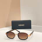 Versace sunglasses, black frames with gold rims and brown-tinted lenses