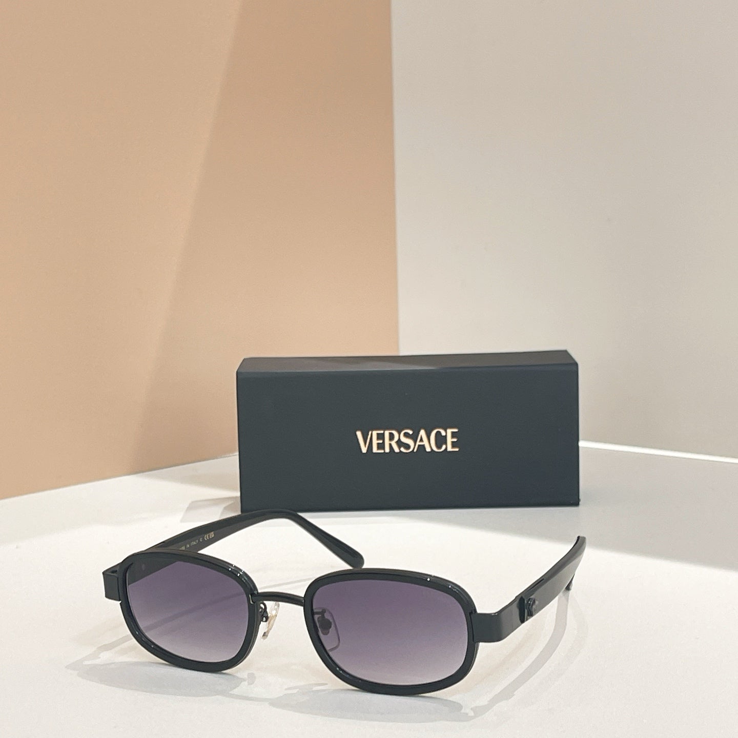 Versace sunglasses, black round frames with purple-tinted lenses