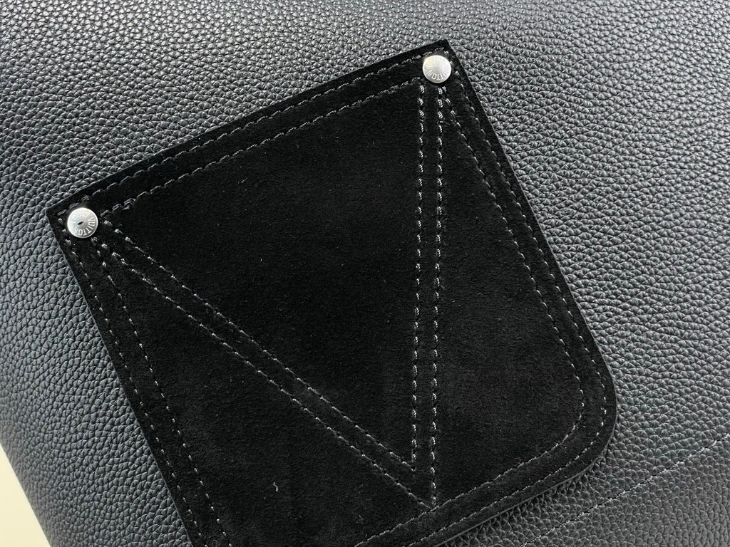 Louis Vuitton bag interior pocket close-up in black leather with stitched edges