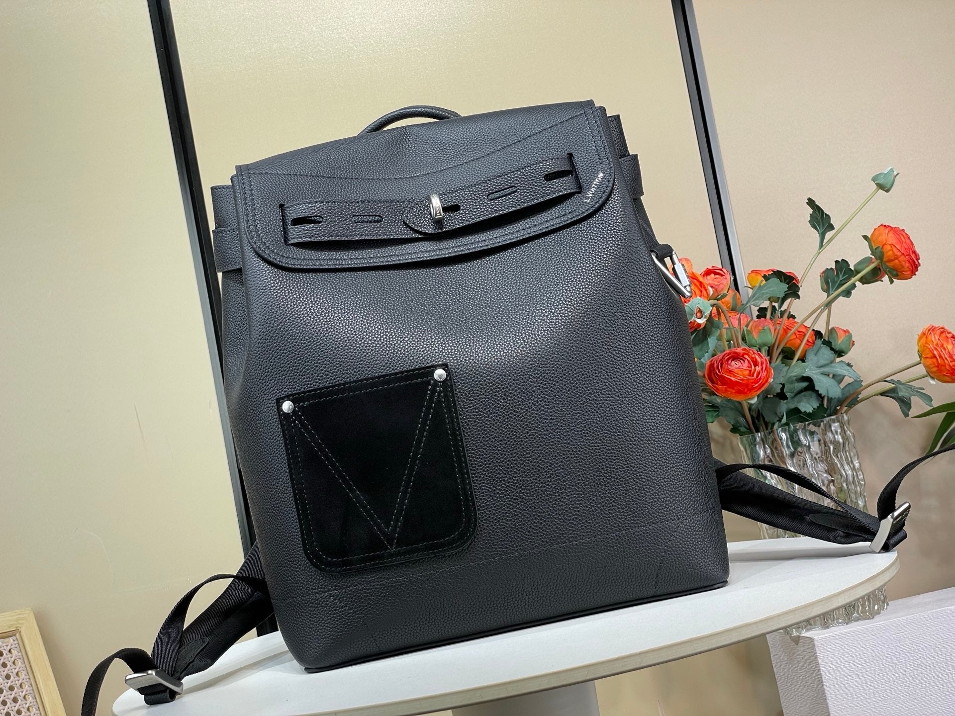 Louis Vuitton bag in dark blue leather, front flap with top handle and crossbody strap