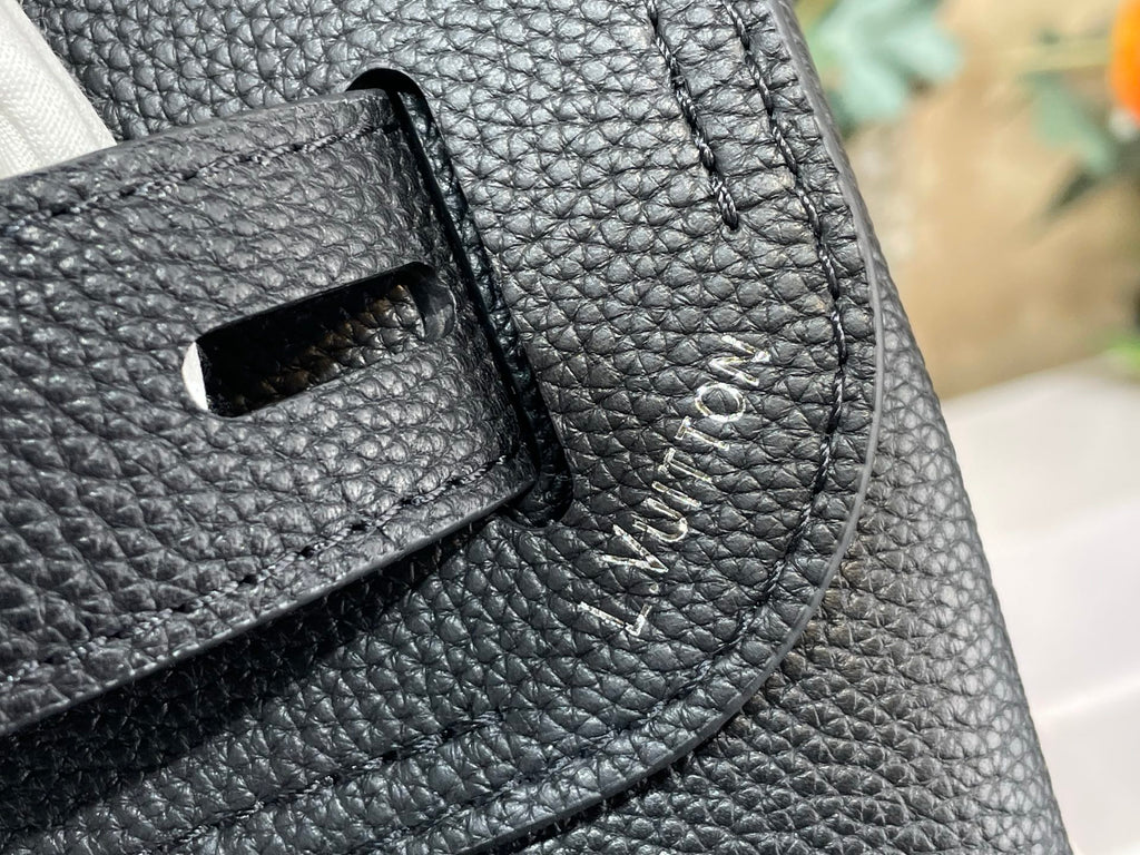 Louis Vuitton bag front close-up of textured leather pocket and stitching