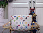 Designer shoulder bag, white with multicolor monogram pattern, gold top handles and hardware