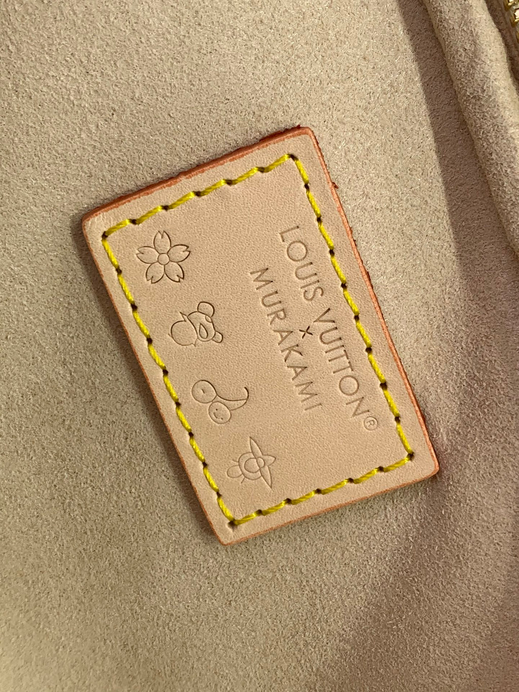 Leather brand patch on tan lining with flower stamp and stitched border