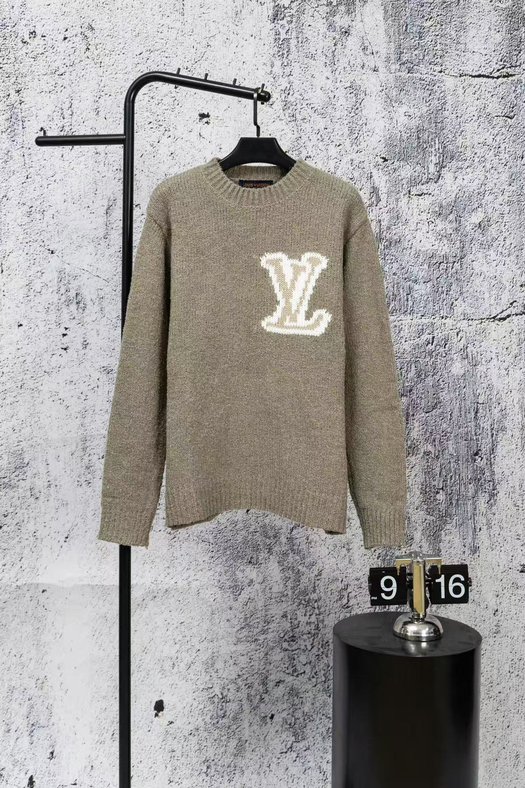Long-sleeve Louis Vuitton knit sweater with large white V logo on chest