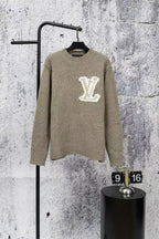 Long-sleeve Louis Vuitton knit sweater with large white V logo on chest