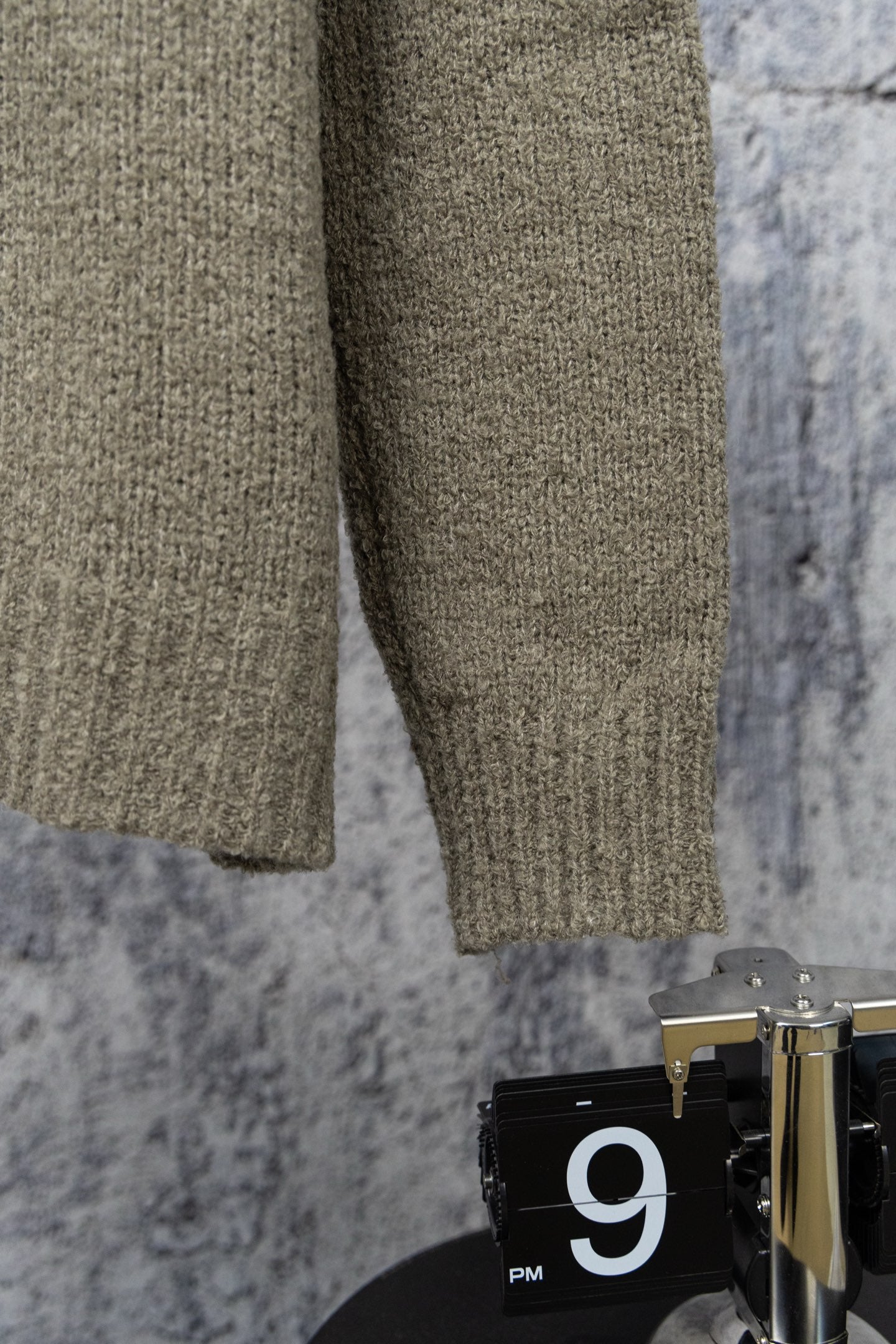 Khaki knit sweater sleeves and cuff detail