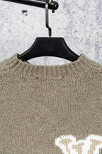 Khaki knit sweater neckline with ribbed collar detail