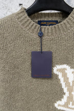 Khaki knit sweater collar with blue Louis Vuitton label and hanging tag