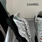 Metallic silver sneaker with white laces and black side panel