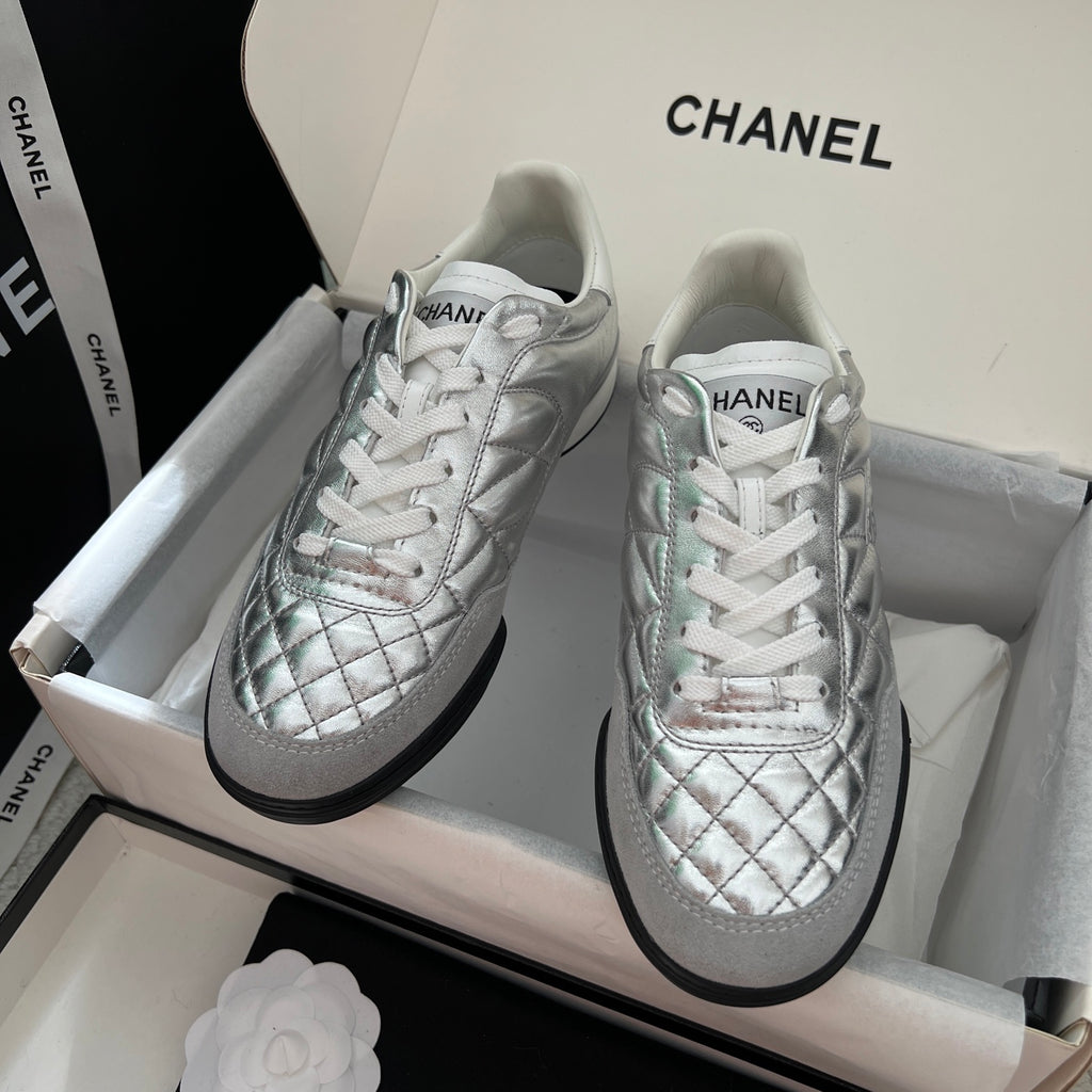 Chanel quilted metallic sneakers with white laces and black rubber soles
