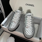 Chanel quilted metallic sneakers with white laces and black rubber soles