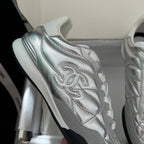 Chanel metallic sneakers close-up: quilted leather with embroidered CC logo
