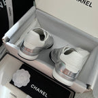 Chanel sneakers: back view with silver heel logo and white rubber soles