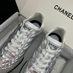 Chanel metallic sneakers, front view: white laces and quilted toe panels