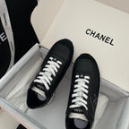 Chanel unisex black leather sneakers with white laces, top view