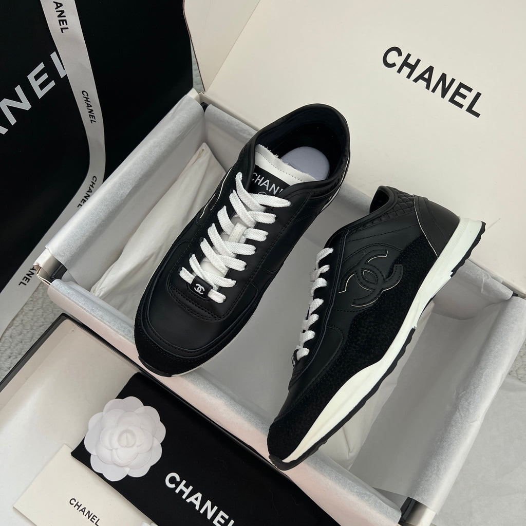 Chanel unisex black leather sneakers with white laces, pair in shoebox