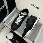 Chanel unisex black leather sneakers with white laces, pair in shoebox