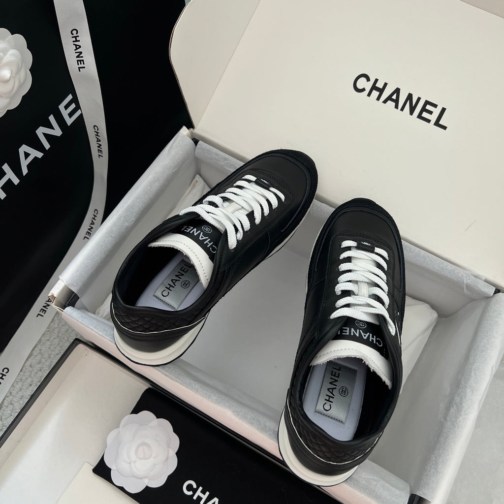 Chanel unisex black leather sneakers with white laces and white-trim sole