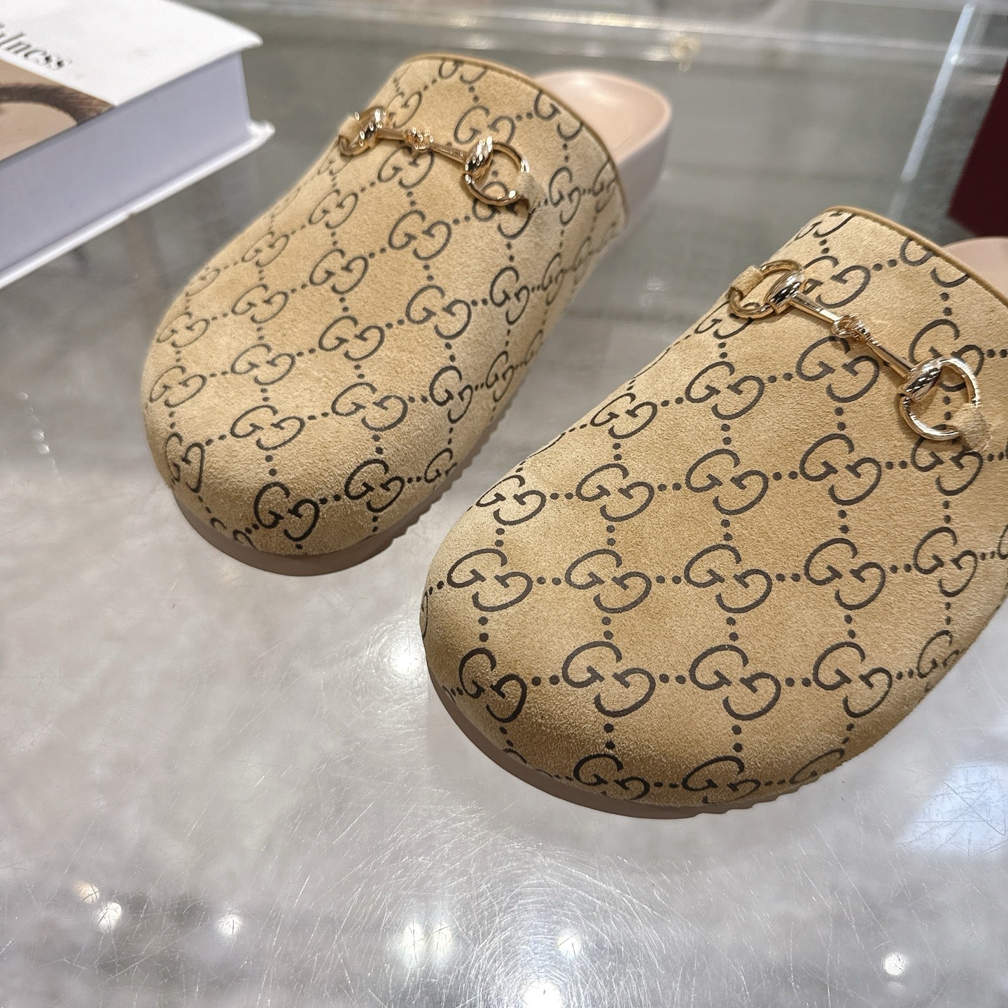 Gucci GG slide sandals, beige logo canvas with metallic chain detail on upper