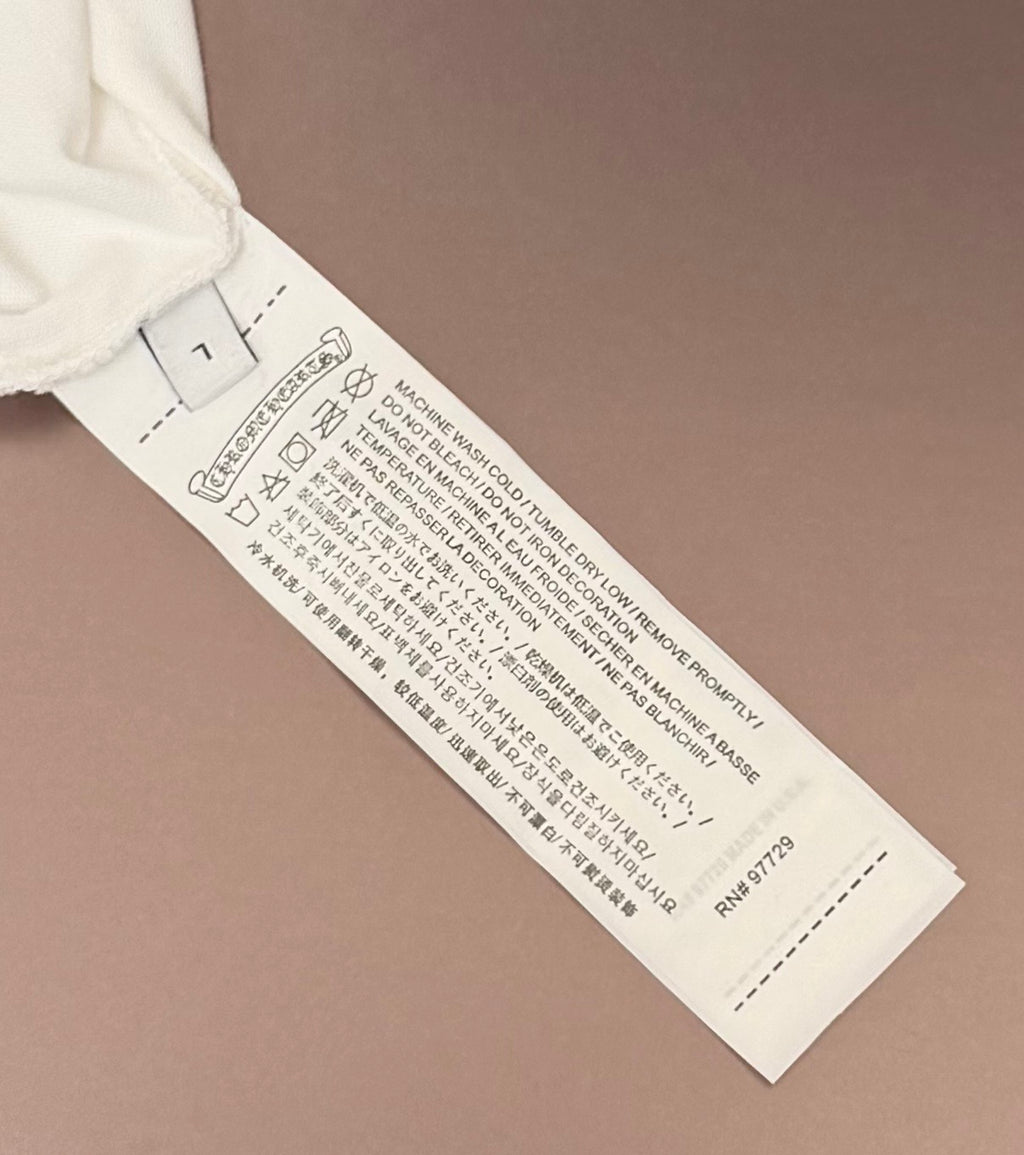 White T-shirt with visible care label and size tag at the inner hem