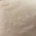 White T-shirt with row of raised embroidered cross motifs