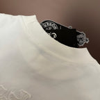 White crew-neck T-shirt neckline with neat stitching and inner brand tag