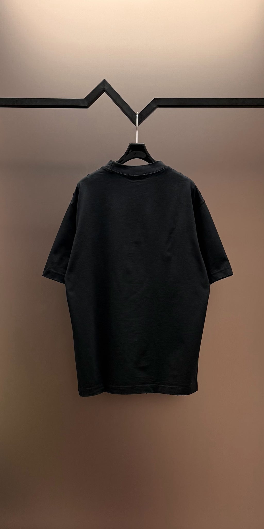 Black short-sleeve T-shirt, back view with crew neck and no visible graphics