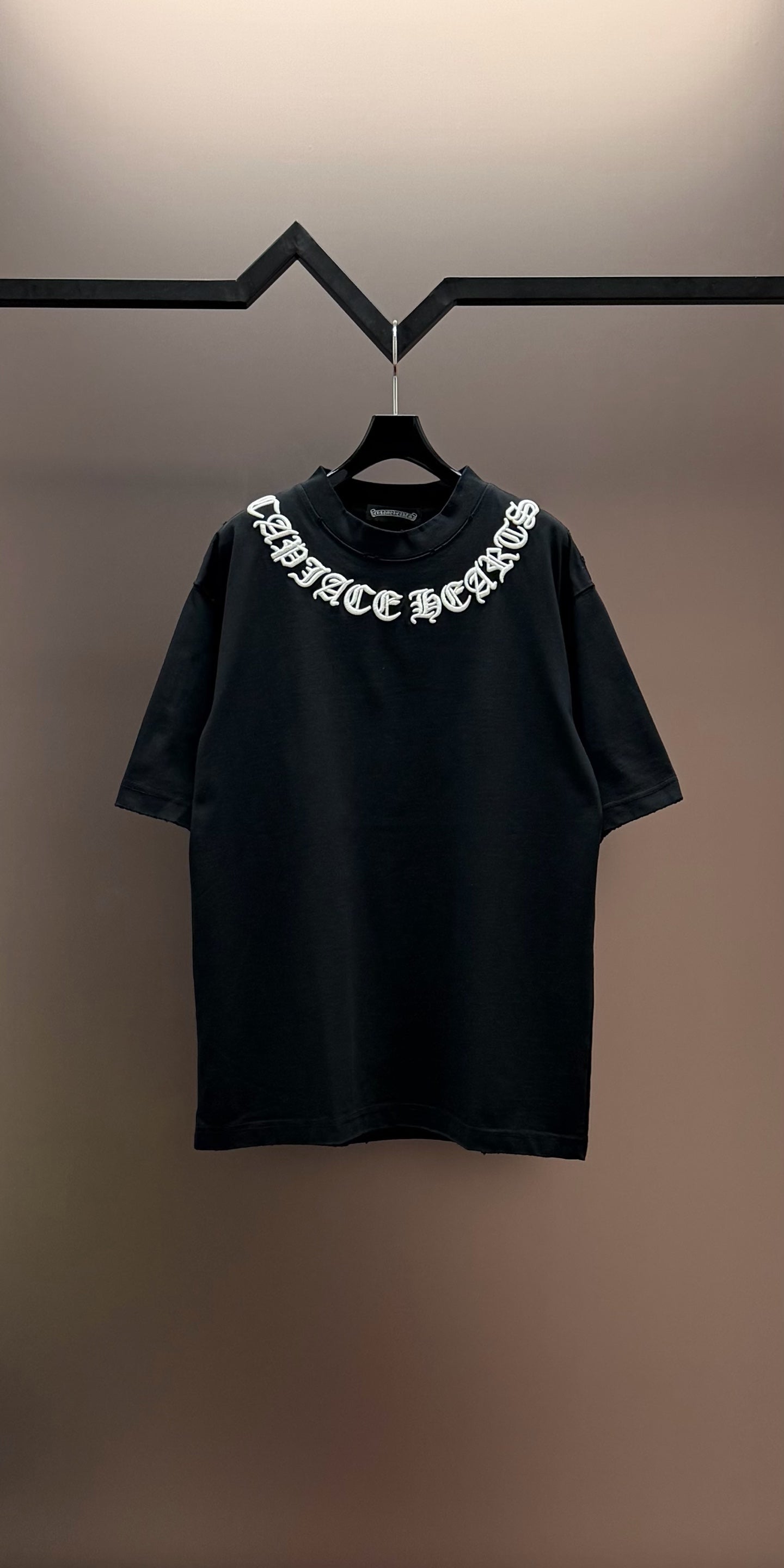 Black short-sleeve T-shirt with crew neck and white logo graphic