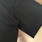 Black short-sleeve T-shirt hem with side seam and stitched edge