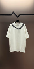 White short-sleeve T-shirt with black embroidered crewneck text graphic