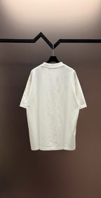 White short-sleeve T-shirt, crewneck style, hanging on a hanger