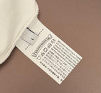 White T-shirt size and care label attached at the inner collar seam