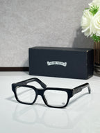 Black rectangular eyeglasses with clear lenses and metal temple detailing