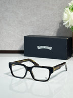 Black rectangular eyeglasses with clear lenses and thin metal temple detailing