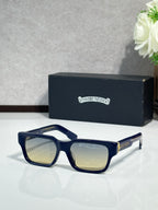 Chrome glasses with navy frame and tinted lenses