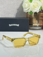 Chrome glasses with gold frame and amber-tinted lenses