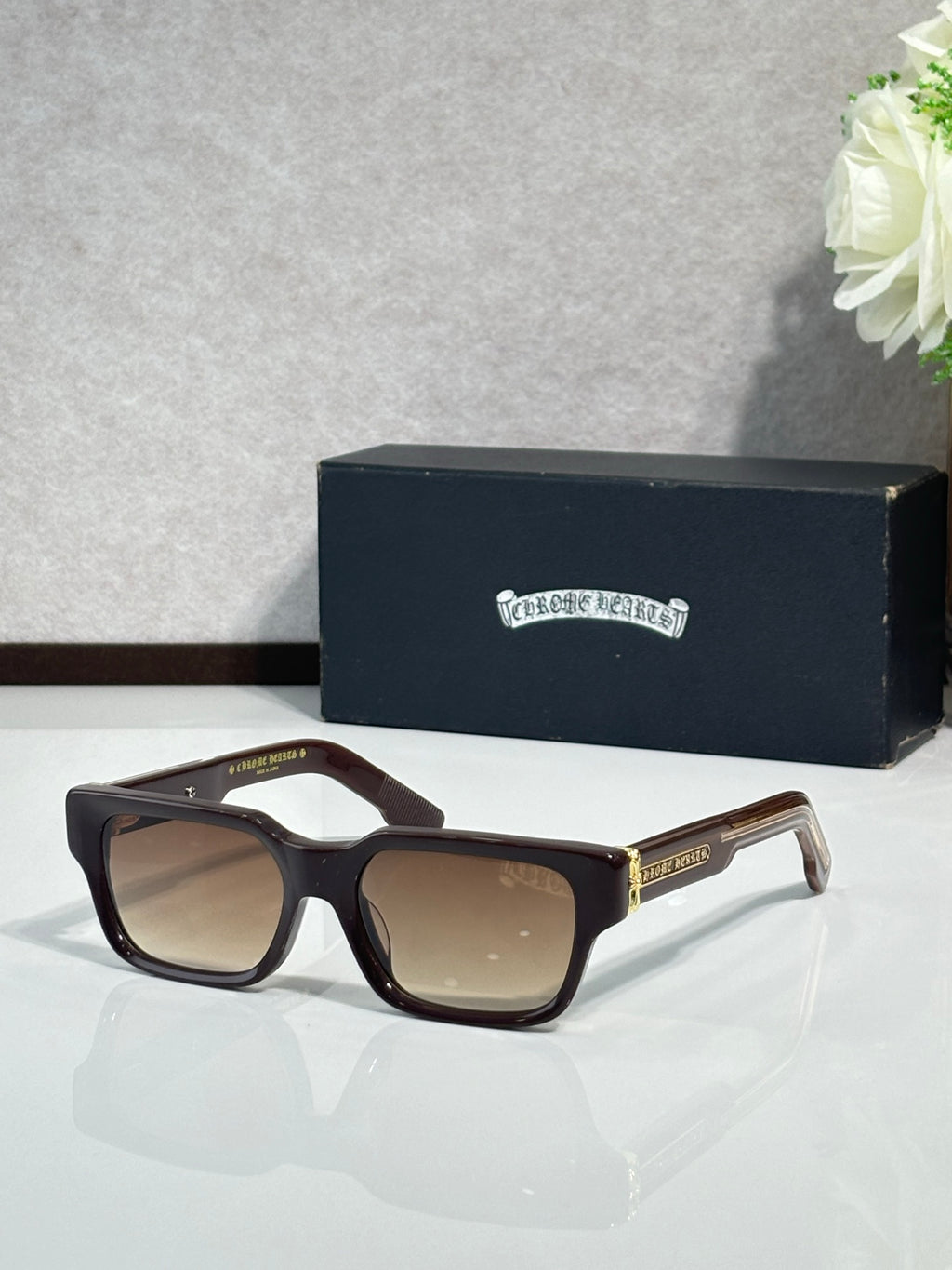 Chrome glasses with dark brown frame and tinted lenses