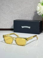 Chrome glasses with gold frame and yellow-tinted lenses