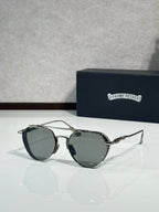 Chrome glasses with smoky dark lenses and metal frame, round oversized shape