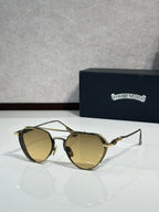 Chrome glasses with tan lenses and gold-tone metal frame, round oversized shape